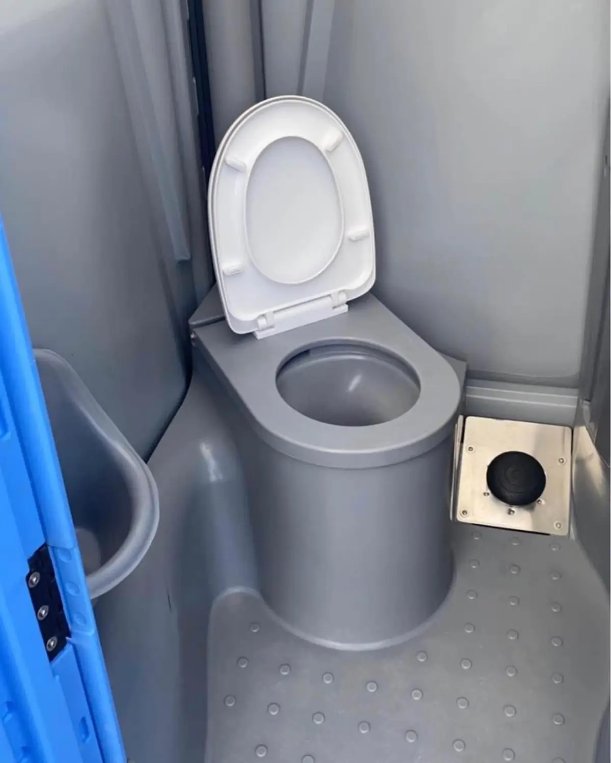 Close view of a flushing seat inside a portable toilet